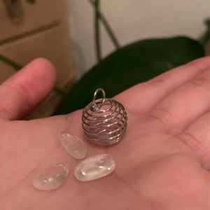 Clear quartz and cage pendant